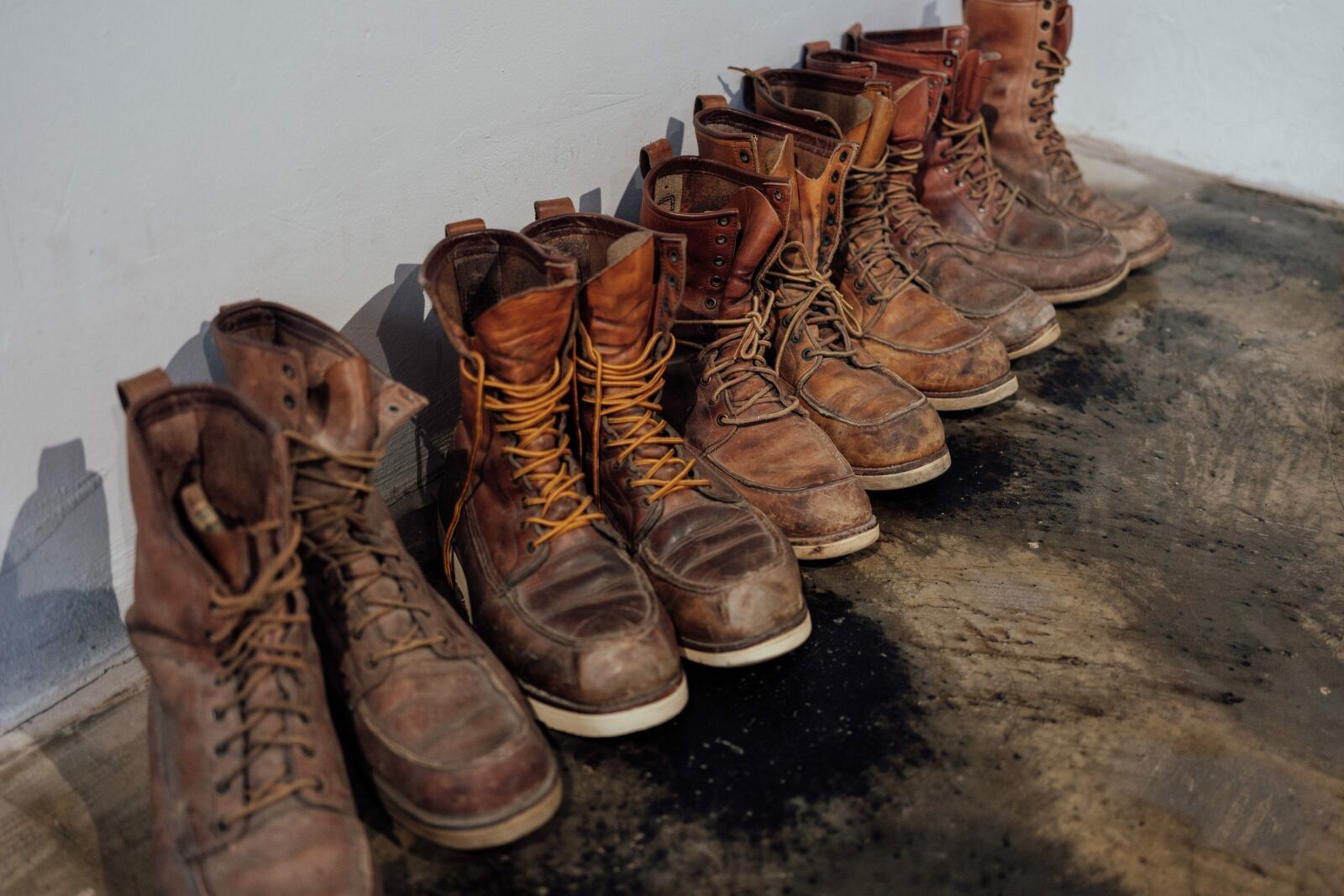 A lot of pairs of old raw and rugged Red Wing Boots