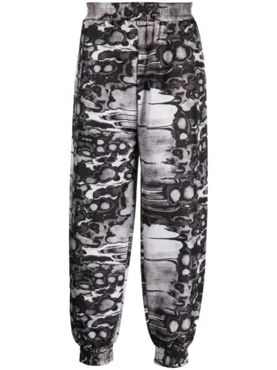 ISO.POETISM Khumbu abstract-print track pants - Black