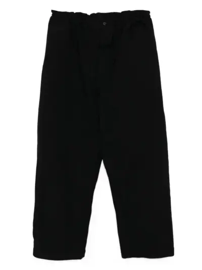 Black Comme Des Garçons garment treated trousers