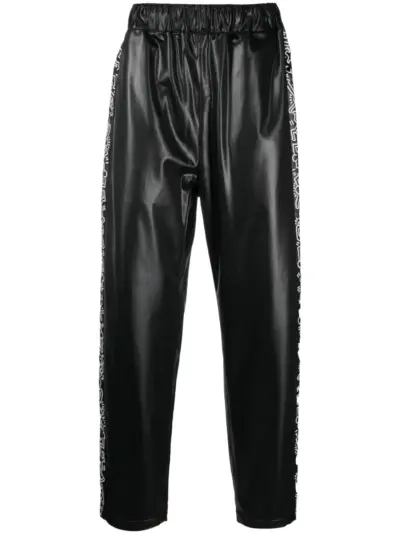 Junya Watanabe Comme des Garçons Pre-Owned x Keith Haring graphic-print track pants - Black