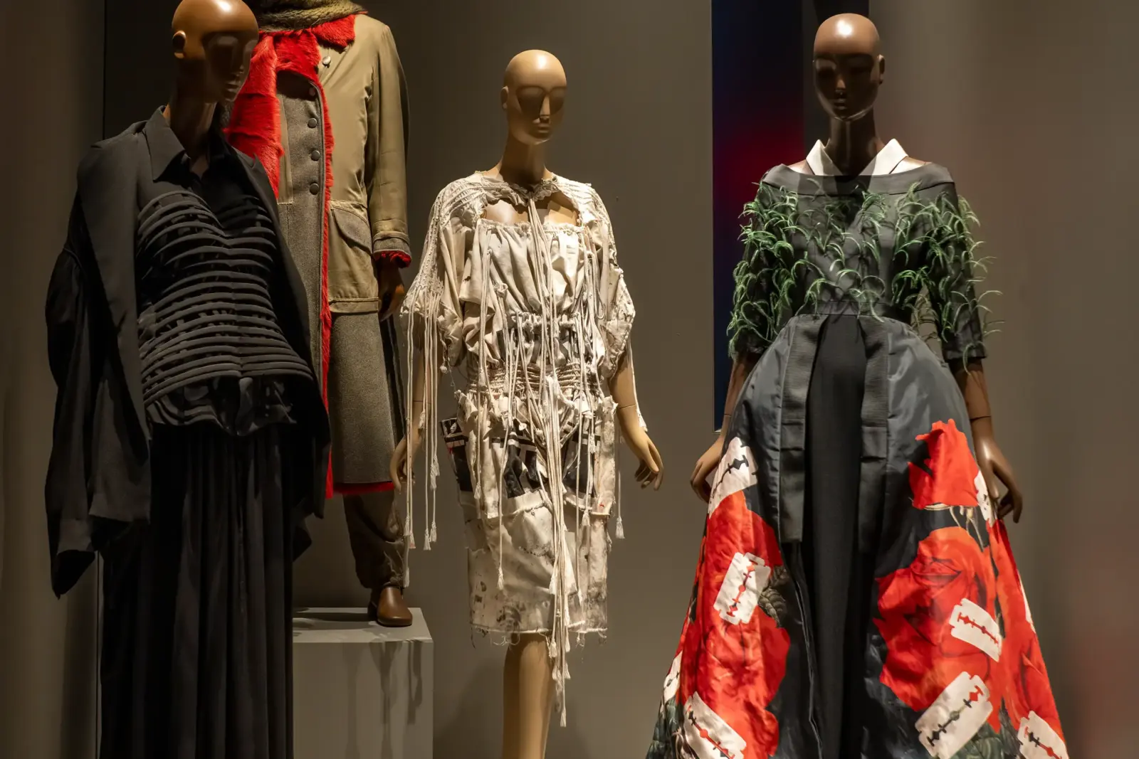 Museum exhibition featuring sculptural darkwear silhouettes and monochrome avant-garde garments at The Museum at FIT