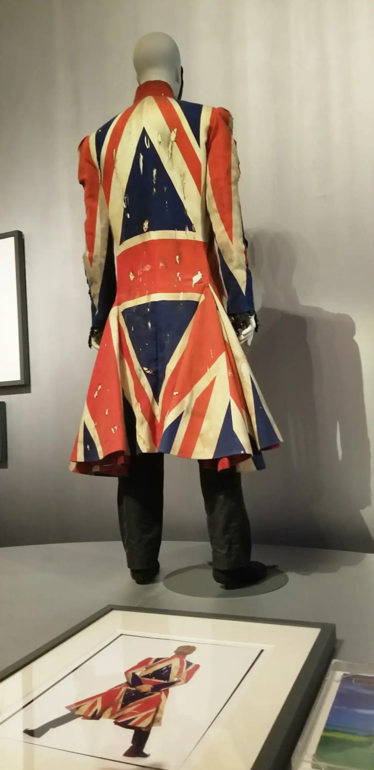 Distressed Union Jack frock coat designed by Alexander McQueen for David Bowie in 1996