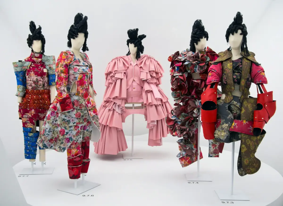 Panoramic installation view of Comme des Garcons sculptural white architectural pavilions and garments at the Met Costume Institute