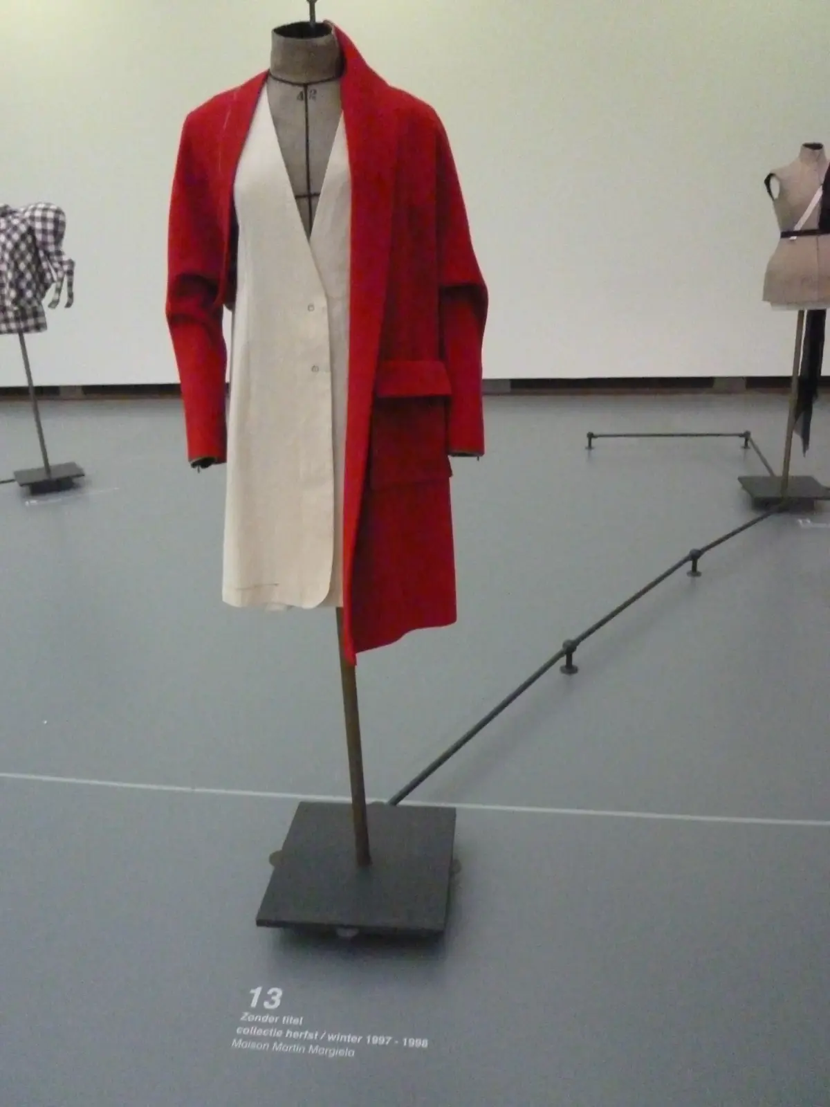 Maison Martin Margiela semi-couture Stockman dressform linen gown and tailored red coat from Autumn Winter 1997-1998