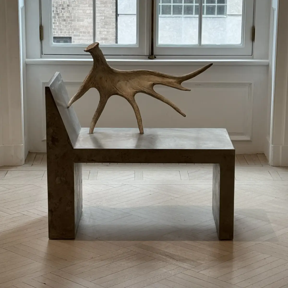 Rick Owens Tomb chair with naturally shed moose antler mounted on monolithic stone slab